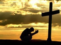 kneeling at the cross